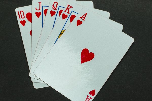 Blackjack table with playing cards and casino chips showing a classic casino games hand in progress